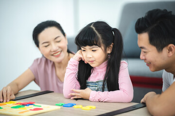 child person family with dad and mom, daughter girl education at home with mother together