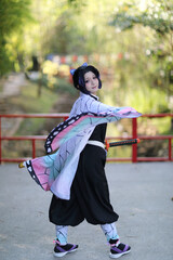 Japan anime cosplay portrait of girl with comic costume with japanese theme garden - 468395555