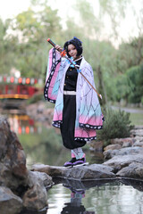 Japan anime cosplay portrait of girl with comic costume with japanese theme garden - 468395565