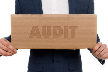 A businessman shows an inscription: AUDIT