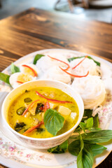 Thai style food, green curry with chicken, delicious vegetable Asian dinner
