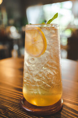 cold drink orange soda with ice, beverage cocktail on cafe table, juice refreshment