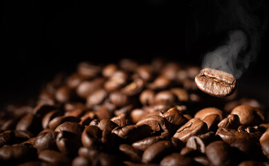 Roasted coffee beans on grey background, closeup