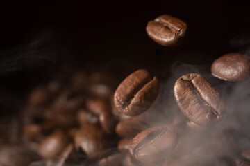 Roasted coffee beans on grey background, closeup