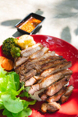 Thai style grilled pork with rice and vegetable, meal meat for dinner or lunch main dishes
