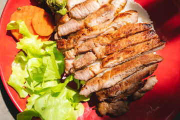 Thai style grilled pork with rice and vegetable, meal meat for dinner or lunch main dishes
