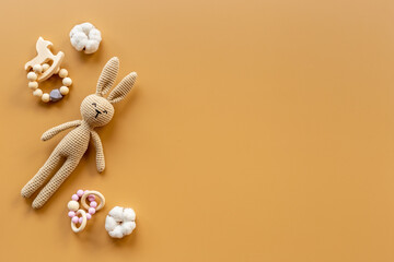 Baby toy rabbit with wooden accessories, overhead view