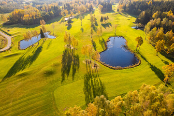 Aerial autumn fall sunny day view of golf course field