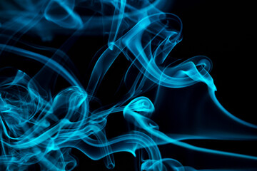 Abstract colored smoke hookah on dark background. Texture. Art Design element. Personal vaporizers fragrant steam. Concept of alternative non-nicotine smoking. E-cigarette. Blurry image, soft focus