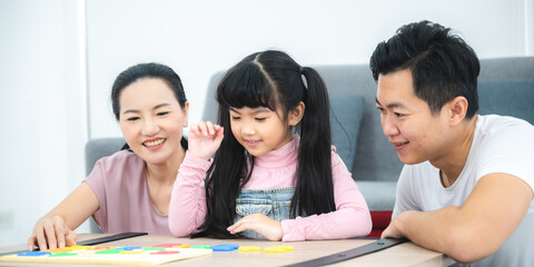child person family with dad and mom, daughter girl education at home with mother together