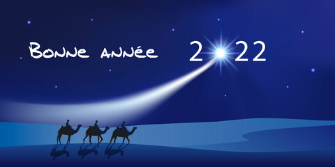 Carte de vœux 2022 montrant les trois rois mages à dos de dromadaire se dirigeant vers Bethléem avec des cadeaux pour célébrer la naissance de Jésus Christ. - obrazy, fototapety, plakaty