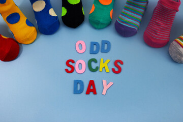 Odd Socks Day. Day lost socks, lonely socks on blue background.