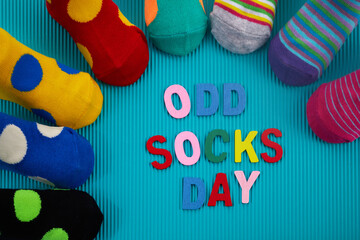 Fototapeta na wymiar Odd Socks Day. Day lost socks, lonely socks on blue background.