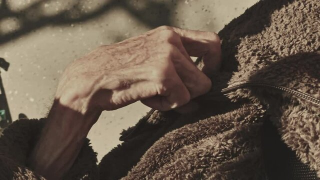 Elderly woman with dementia paralysed hand.