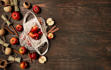 Apple baking seasonal concept. Ingredients for apple pie (red apple, flour, eggs, sugar, cinnamon) on a rustic wooden table. Top view flat lay. Free space for your text.