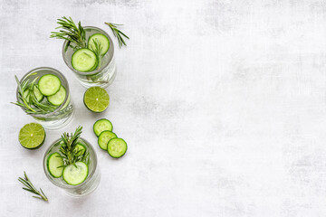 Homemade lemonade with cucumber lemon slices and herbs