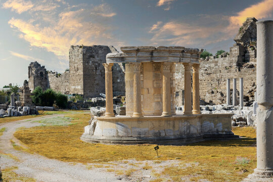 side tyche temple. The temple built by the Side people inside the Agora for the god who rules the sky and the stars. cloudy blue sky. no people. selective focus ruins.