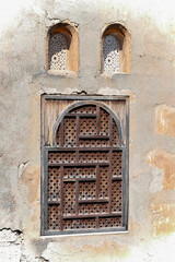 Old carved wooden window in Moorish style in Granada, Andalusia.