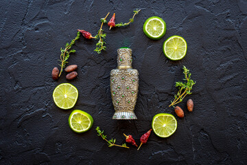 Silver bottle of arabian oud perfume or agar wood oil