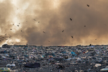 Landfill with burning trash piles. Environment pollution concept