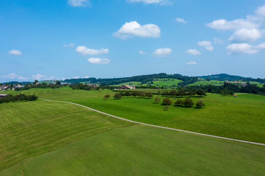 Panorama aerial view of the green Swiss hills on a summers day with blue skies.