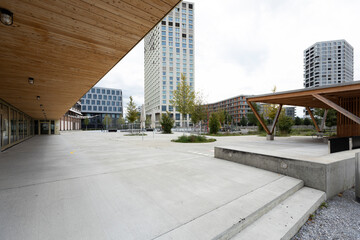 Urban landscape in Zurich with modern wooden roof and skyscrapers in the distance