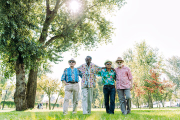 group of senior friends playing at the park