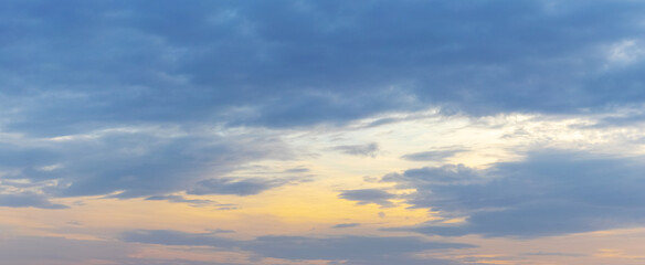 Picturesque dramatic sky with dark clouds at sunset