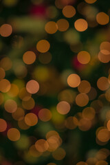 unfocused bokeh lights from garland lamps Christmas eve concept abstract vertical photo