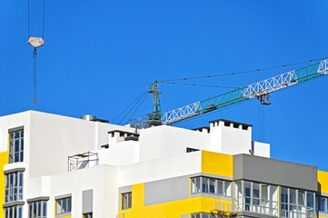 Crane and highrise construction site