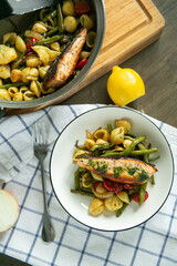 salmon steak with pasta and beans