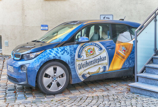 Weihenstephan, Bavaria, Germany - Car painted with the advertising, the emblem and the colors of the Weihenstephan brewery, the World's Oldest Brewery since year 1040 on the site of the former Abbey