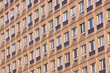 Fototapeta na wymiar Facade of a typical precast apartment building in the former eastern part of Berlin, Germany