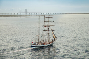 Öresund - tall sailing ship at the Oresund bridge between Copenhagen and Malmo