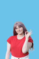 Fashionable Young Girl Expressing OK Sign 