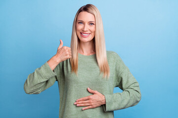 Photo of attractive mature woman arm on belly healthy show thumb-up great suggest advert isolated...