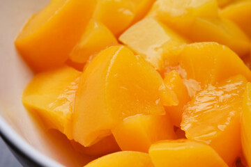 Close up of canned sliced mango. Shallow depth of field