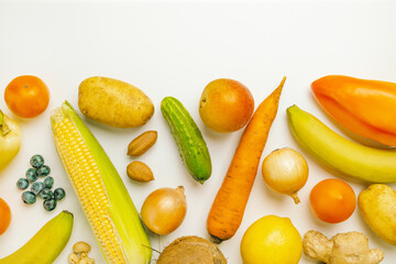 Various healthy fresh vegetables, fruits and nuts on a white background. Vegetables, healthy vegan organic food