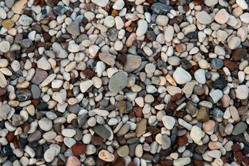 Galyaka on the beach, small colored pebbles, background, copy space.