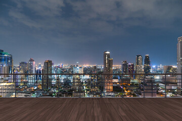 Fototapeta na wymiar Panoramic Bangkok skyline view, wooden observatory deck on rooftop, night time. Asian corporate and residential lifestyle. Financial city downtown, real estate. Product display mockup empty roof
