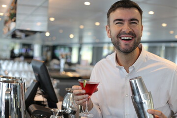 Mixologist preparing a cocktail in a bar