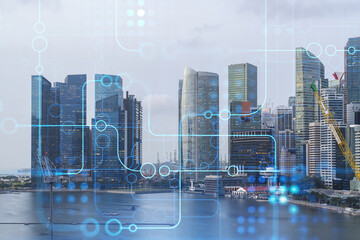 Technology hologram over panorama city view of Singapore. The largest tech hub in Asia. The concept of developing coding and high-tech science. Double exposure.