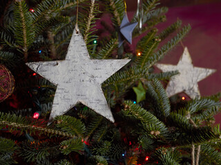 Home made birch bark Christmas ornament in an evergreen tree