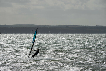 Windsurfer on The Solent with The Isle of Wight in the background