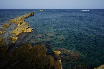 Trapani harbour seaside rocks view on a summer day, Sicily, Italy
