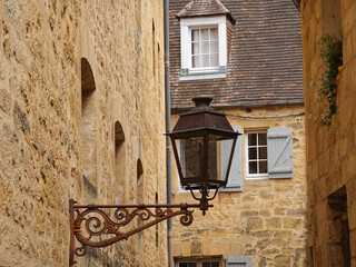 Lamppost in the historic city center of Sarlat La Caneda in France.