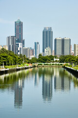 Modern buildings in Kaohsiung, Taiwan, and the beautiful reflection of the Qianzhen canal.