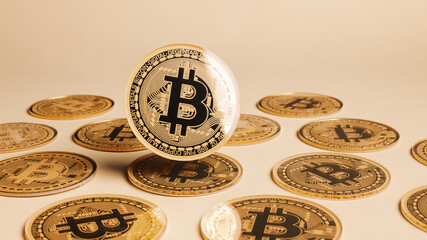 Cryptocurrency composition with shiny golden bitcoins on matching beige background. Creative cryptocurrency investment concept. Financial market, digital gold money and stock business.