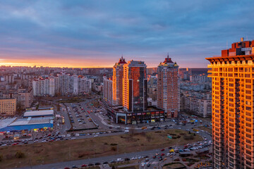 The setting sun illuminates one of the districts of Kiev, Ukraine.