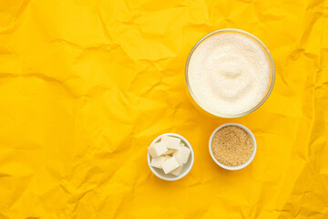 Different types of sugar on yellow background with copy space. Diet and healthy food concept. Healthy lifestyle.